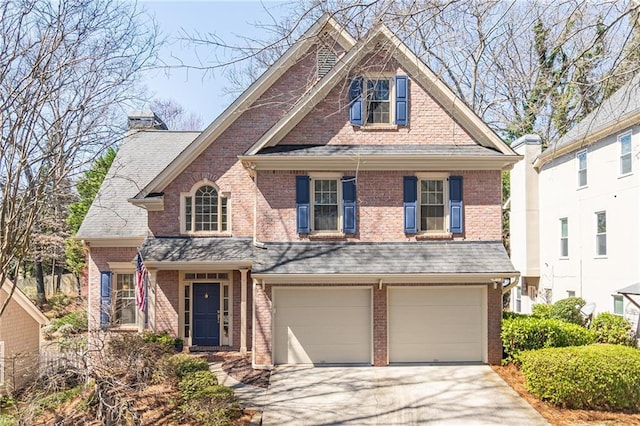 view of front facade with a garage, brick siding, driveway, and a shingled roof