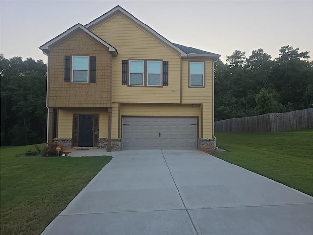 view of front facade featuring a front yard and a garage