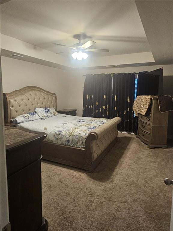 bedroom with ceiling fan and carpet flooring