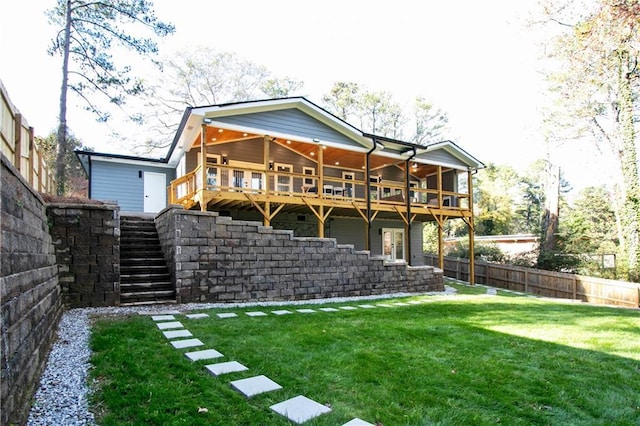 rear view of house with a yard