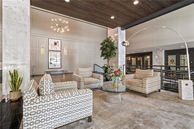 620 Peachtree St NE Unit 911, Atlanta, GA 30308 - building lobby featuring a high ceiling, recessed lighting, a decorative wall, and ornamental molding