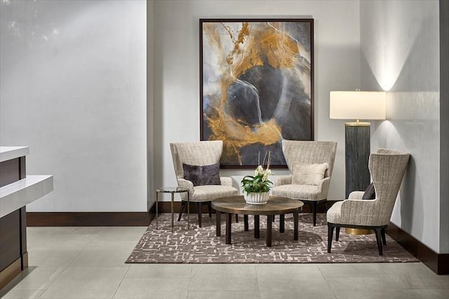 sitting room with light tile floors