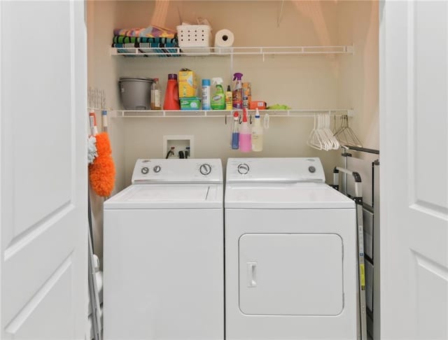 laundry room with hookup for a washing machine and washing machine and dryer