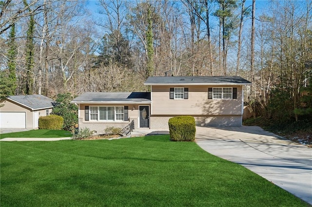 tri-level home with a porch, a front yard, an outbuilding, and a garage