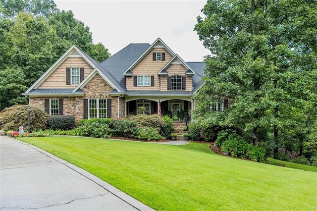 craftsman-style house with a front yard