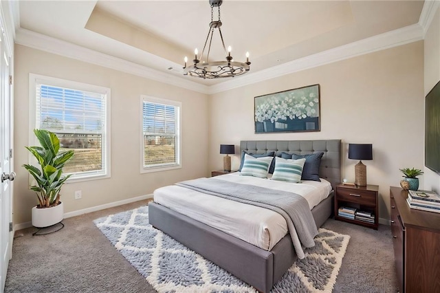 bedroom featuring carpet flooring, a tray ceiling, and a notable chandelier