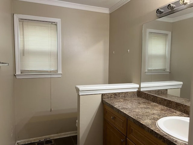 bathroom featuring vanity, tile patterned flooring, and crown molding