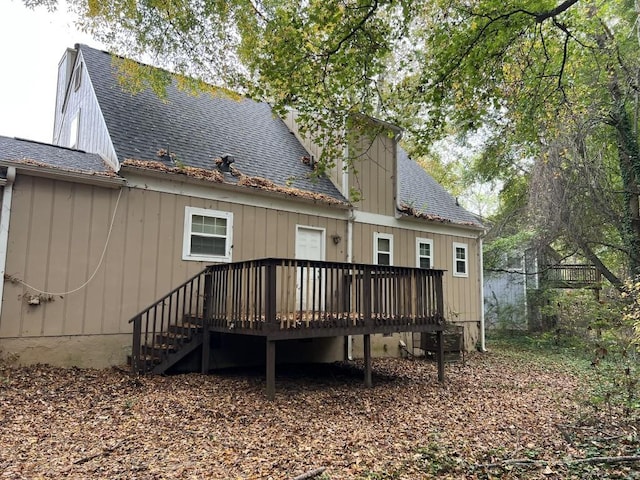 rear view of house with a wooden deck