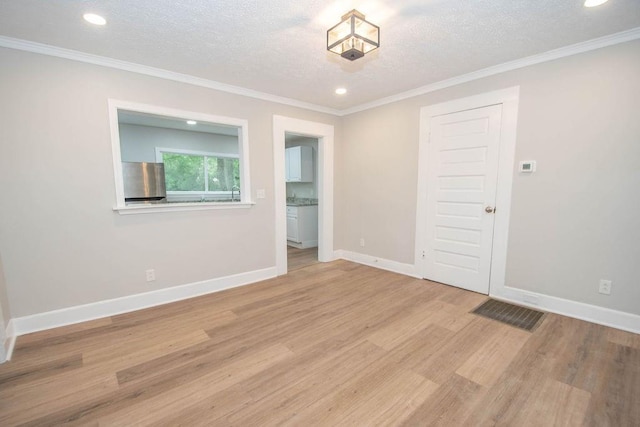 1402 Elm St, Lagrange, GA 30240 - empty room with light wood-style floors, baseboards, recessed lighting, and a textured ceiling