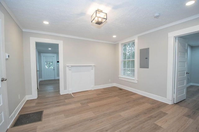 1402 Elm St, Lagrange, GA 30240 - empty room with visible vents, wood finished floors, baseboards, a textured ceiling, and electric panel