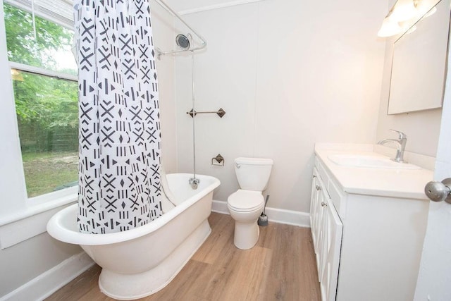1402 Elm St, Lagrange, GA 30240 - full bath featuring toilet, baseboards, wood finished floors, and vanity