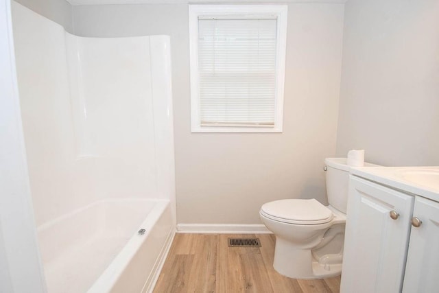 1402 Elm St, Lagrange, GA 30240 - full bathroom with visible vents, wood finished floors, baseboards, vanity, and toilet