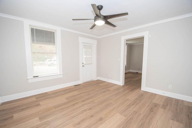 1402 Elm St, Lagrange, GA 30240 - spare room featuring a ceiling fan, visible vents, baseboards, light wood-style floors, and ornamental molding