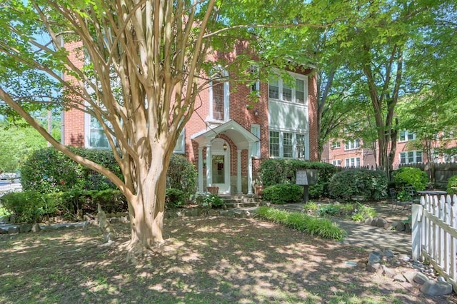 view of front facade featuring brick siding
