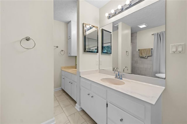 1438 Heritage Glen Dr, Marietta, GA 30068 - full bath with marble finish floors, double vanity, and a textured ceiling