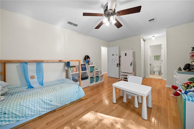 1438 Heritage Glen Dr, Marietta, GA 30068 - bedroom featuring wood finished floors, a ceiling fan, and ensuite bathroom