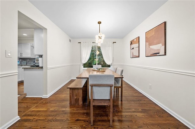 1438 Heritage Glen Dr, Marietta, GA 30068 - dining space featuring a chandelier and dark wood-type flooring