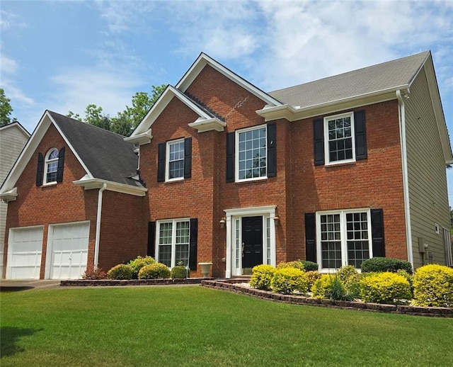 1713 Paramore NE, Marietta, GA 30062 - colonial home featuring brick siding, a garage, and a front lawn