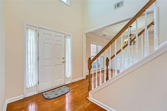 1713 Paramore Pl NE, Marietta, GA 30062 - entrance foyer with wood finished floors, ornamental molding, and stairs