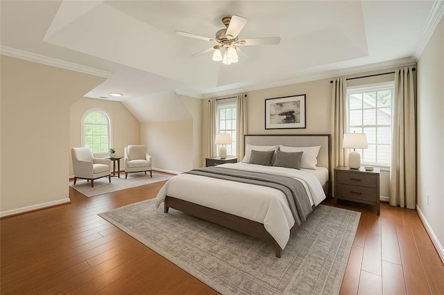1713 Paramore Pl NE, Marietta, GA 30062 - bedroom featuring hardwood / wood-style flooring, a tray ceiling, a ceiling fan, crown molding, and vaulted ceiling