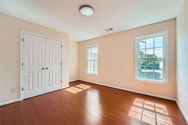 1713 Paramore Pl NE, Marietta, GA 30062 - unfurnished bedroom featuring wood finished floors and a closet