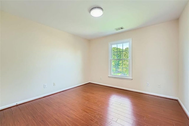 1713 Paramore Pl NE, Marietta, GA 30062 - spare room featuring wood finished floors and baseboards