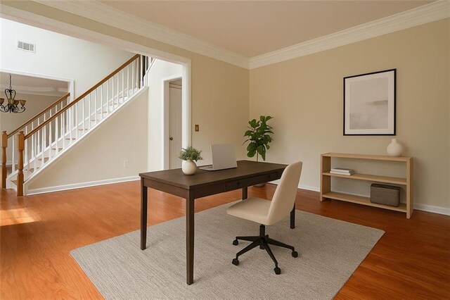 1713 Paramore Pl NE, Marietta, GA 30062 - home office with wood finished floors, ornamental molding, and a chandelier