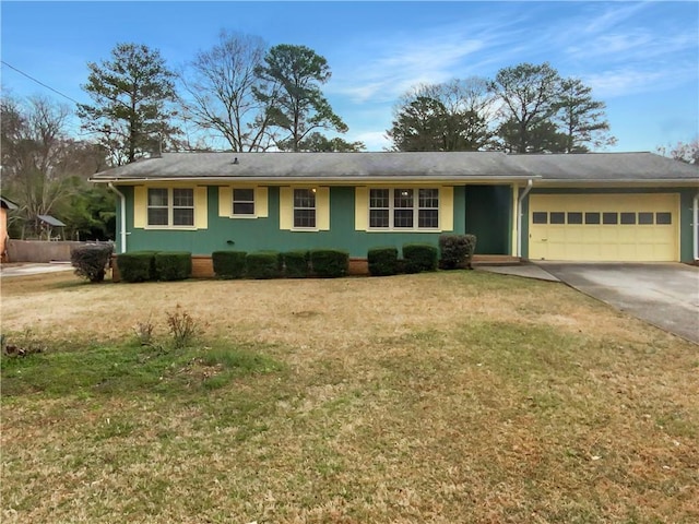 ranch-style house featuring a front lawn and a garage