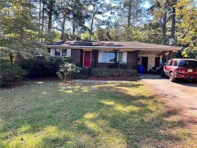 single story home featuring a carport and a front yard