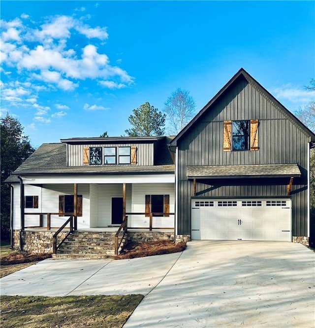 modern farmhouse featuring a porch, concrete driveway, an attached garage, and roof with shingles