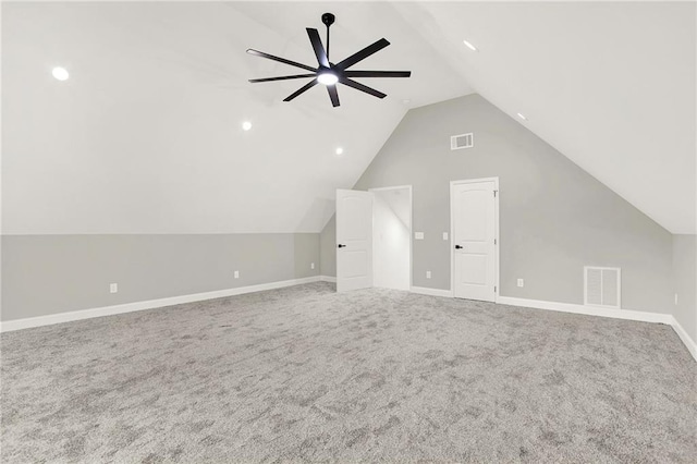 additional living space featuring vaulted ceiling, carpet flooring, visible vents, and ceiling fan