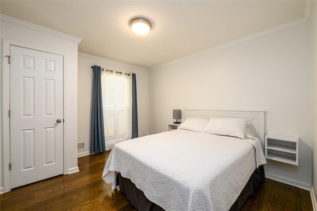 bedroom featuring ornamental molding and dark hardwood / wood-style floors