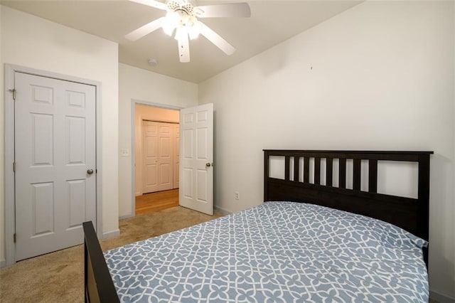 carpeted bedroom featuring ceiling fan