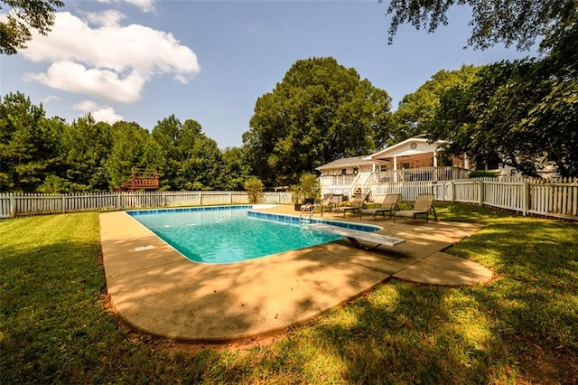 view of pool featuring a diving board, a patio area, and a lawn