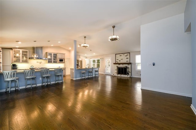 living room featuring dark wood-type flooring and lofted ceiling