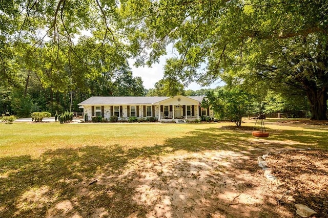 ranch-style home featuring a porch and a front yard