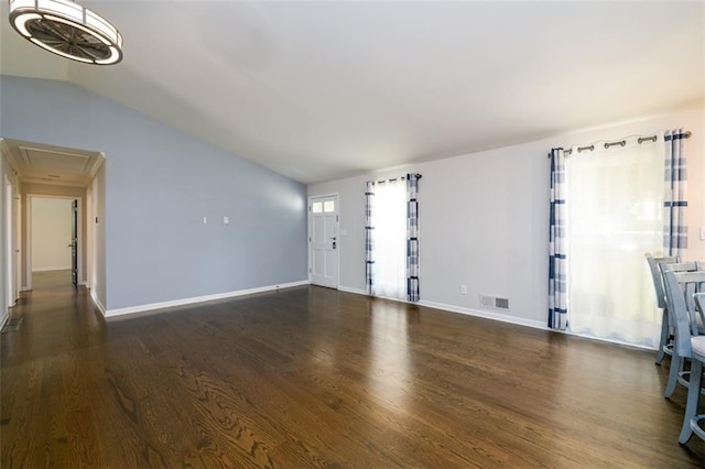 unfurnished living room with dark wood-type flooring and lofted ceiling