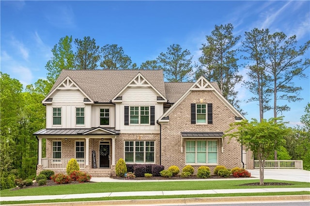 2622 Running River Ct, Lawrenceville, GA 30045 - craftsman-style house with brick siding, a porch, and a front lawn