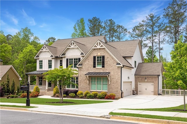 2622 Running River Ct, Lawrenceville, GA 30045 - craftsman-style house featuring driveway, an attached garage, brick siding, and a yard