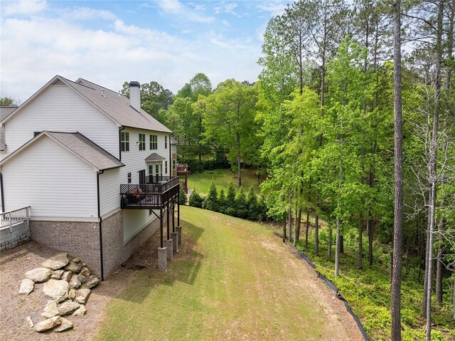 2622 Running River Ct, Lawrenceville, GA 30045 - view of green lawn featuring a wooden deck