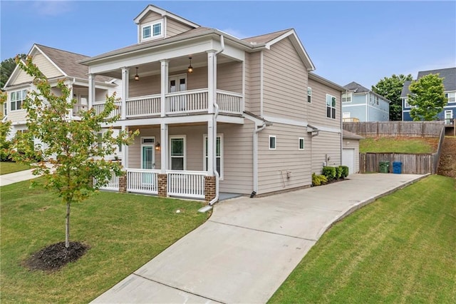 view of front of home with a balcony, a porch, driveway, and a garage