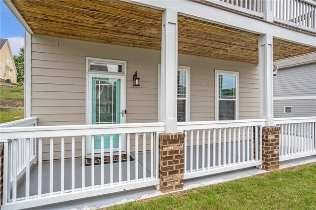 view of side of home with a porch