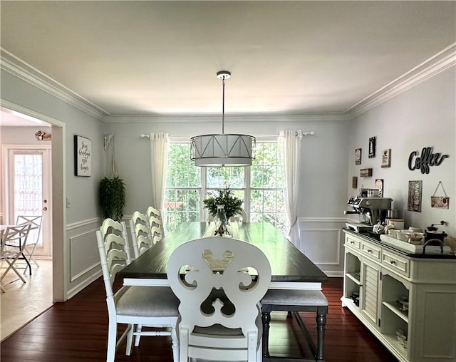 627 Arbour Way, Suwanee, GA 30024 - dining space featuring healthy amount of natural light, crown molding, wainscoting, dark wood finished floors, and a decorative wall