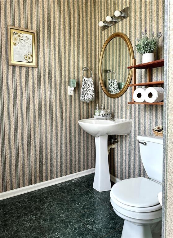 627 Arbour Way, Suwanee, GA 30024 - bathroom with toilet, baseboards, tile patterned floors, and wallpapered walls