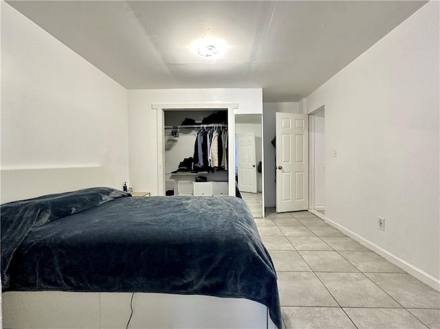 627 Arbour Way, Suwanee, GA 30024 - bedroom featuring light tile patterned floors, baseboards, and a closet