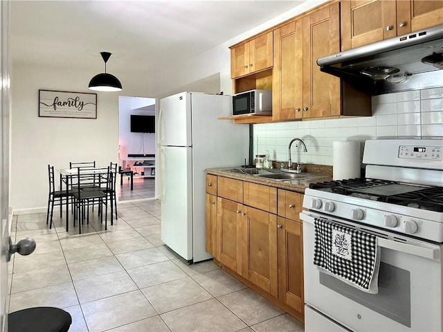 627 Arbour Way, Suwanee, GA 30024 - kitchen featuring white appliances, under cabinet range hood, a sink, tasteful backsplash, and light tile patterned flooring