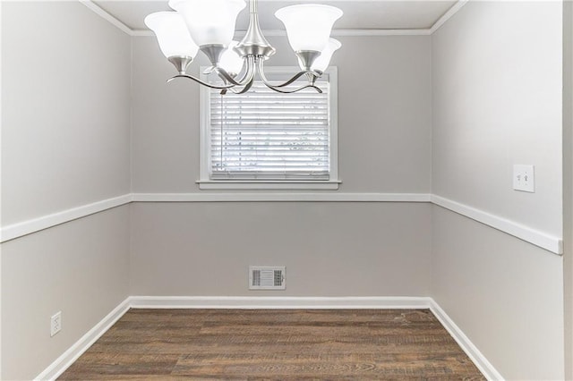 unfurnished dining area featuring baseboards, visible vents, a chandelier, and crown molding