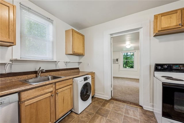 kitchen with washer / dryer, range with electric stovetop, a sink, dishwasher, and baseboards