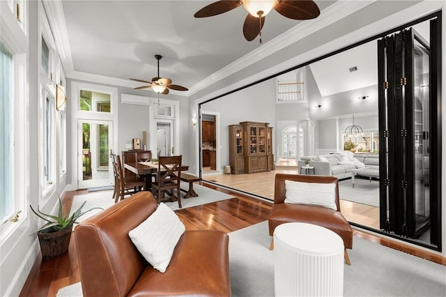 interior space featuring light wood-type flooring, ceiling fan, and crown molding