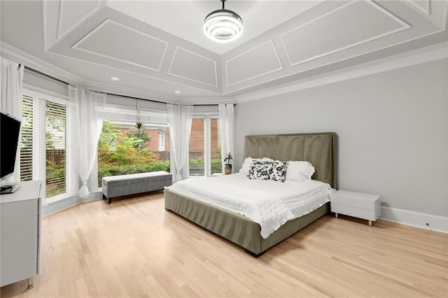 bedroom with crown molding, coffered ceiling, light wood-style flooring, and baseboards